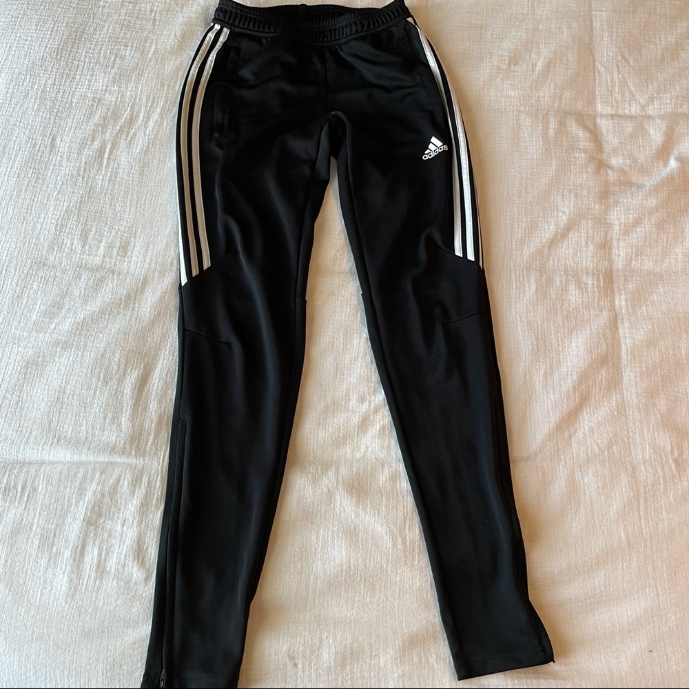 Adidas track pants.